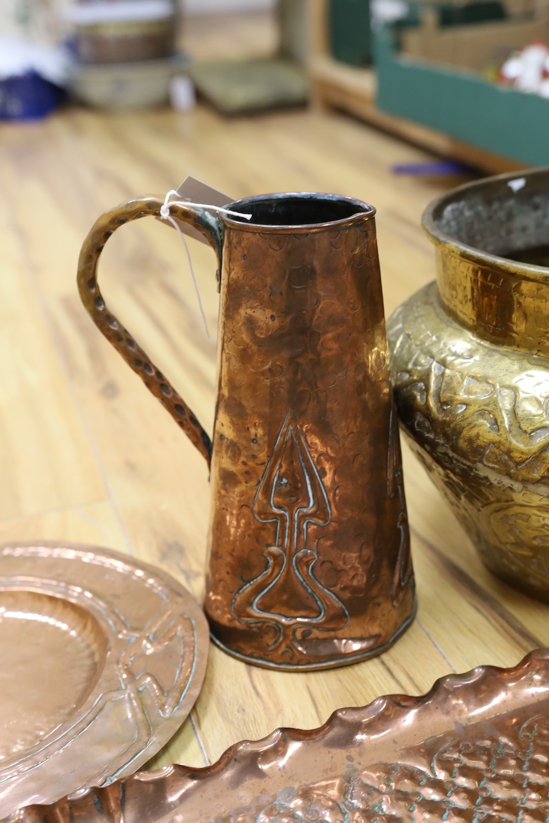 Metalware including embossed copper tray and jug, brass jardiniere, two mortars and pestle (7)